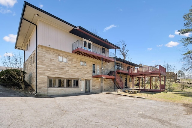 305 Myers Ter, Carthage, TN 37030 - back of house featuring stone siding, a balcony, stairway, and a deck