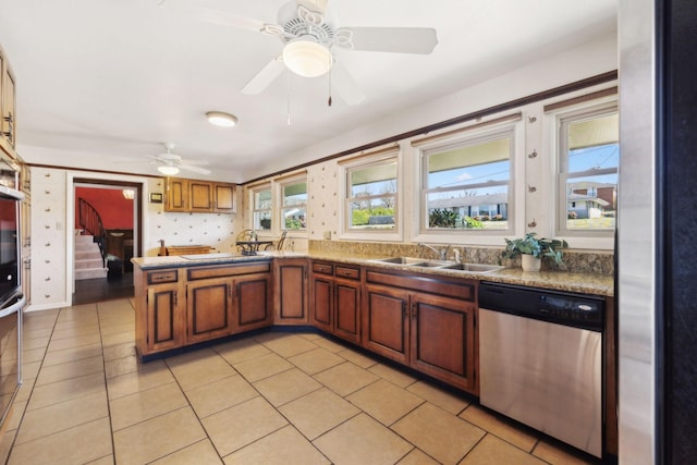 305 Myers Ter, Carthage, TN 37030 - kitchen with dishwasher, a ceiling fan, brown cabinets, light tile patterned floors, and a peninsula