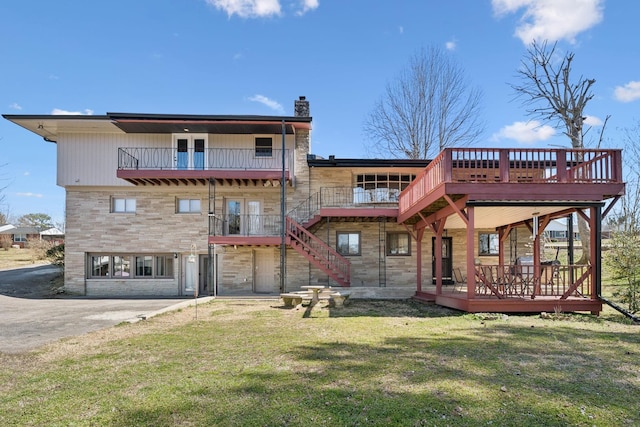 305 Myers Ter, Carthage, TN 37030 - back of house with stone siding, a yard, a chimney, and a deck