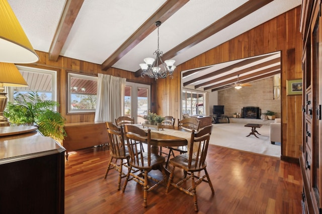305 Myers Ter, Carthage, TN 37030 - dining room featuring wooden walls, a fireplace, a ceiling fan, a chandelier, and wood finished floors
