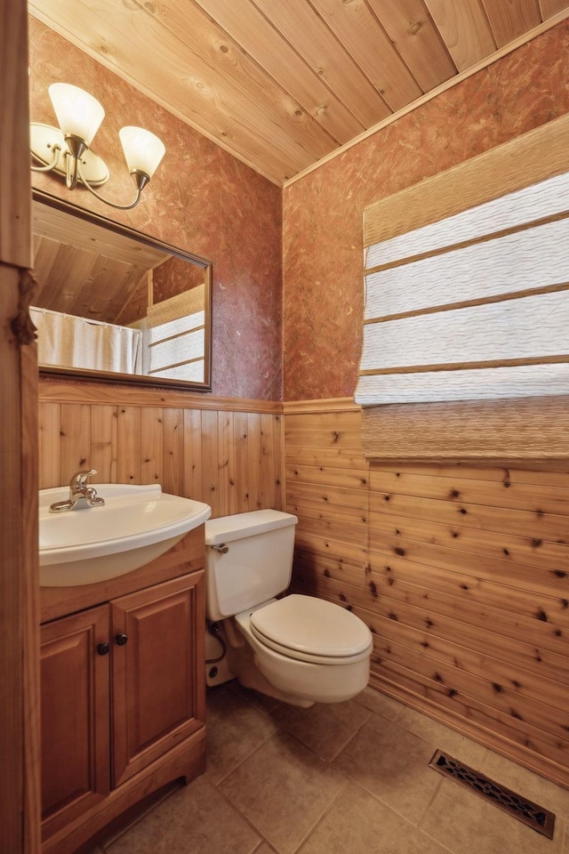 305 Myers Ter, Carthage, TN 37030 - half bath featuring a wainscoted wall, vanity, wallpapered walls, tile patterned flooring, and wood walls