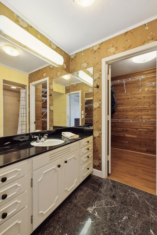 305 Myers Ter, Carthage, TN 37030 - full bathroom featuring vanity, ornamental molding, wallpapered walls, and a walk in closet