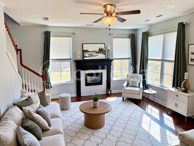 1808 Luke Ct, Columbia, TN 38401 - living area featuring healthy amount of natural light, wood finished floors, stairway, and a ceiling fan