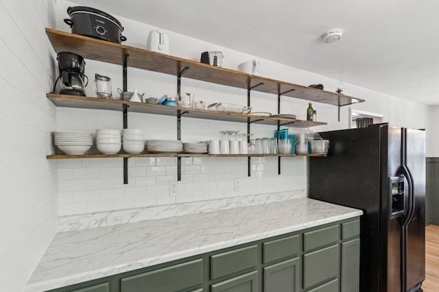 3721 Wharton Dr, Nashville, TN 37211 - kitchen featuring open shelves, green cabinetry, black fridge, and tasteful backsplash
