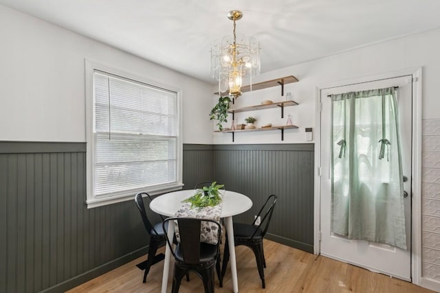 3721 Wharton Dr, Nashville, TN 37211 - dining room with a wainscoted wall, a chandelier, and light wood-style floors