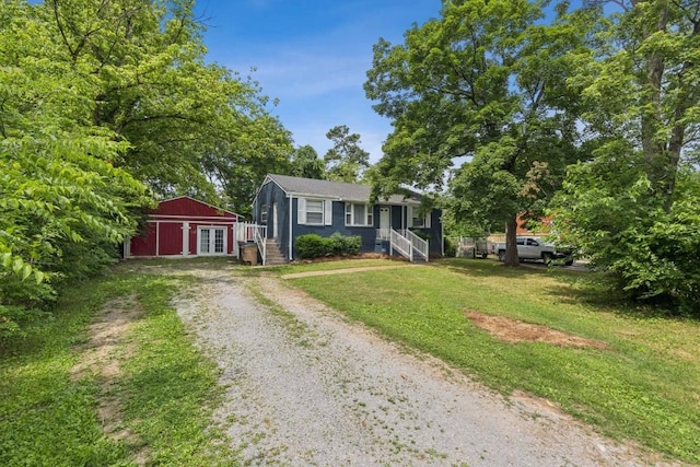 3721 Wharton Dr, Nashville, TN 37211 - bungalow featuring driveway, a front yard, french doors, and an outbuilding