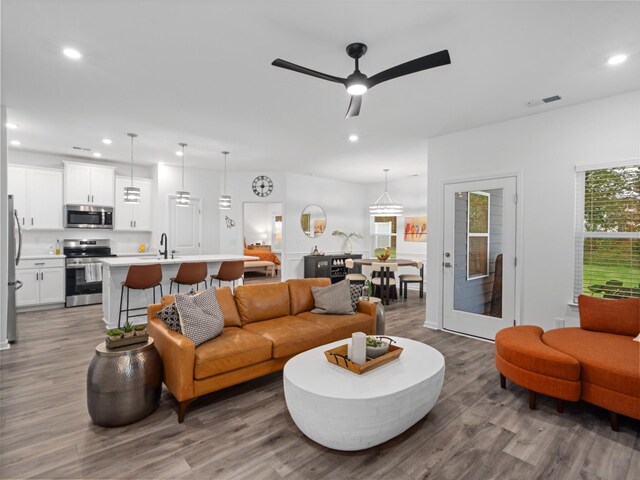 345 Winston Way, Gallatin, TN 37066 - living room with wood finished floors, recessed lighting, and ceiling fan