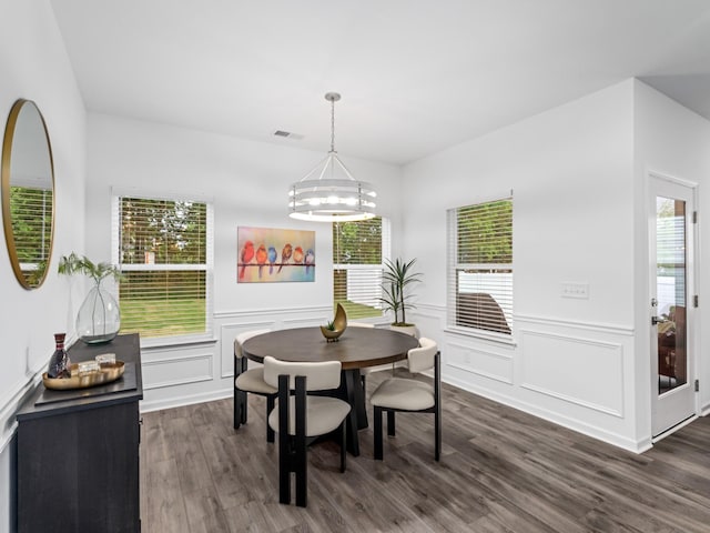 345 Winston Way, Gallatin, TN 37066 - dining area with a chandelier, dark wood-style flooring, a decorative wall, plenty of natural light, and a wainscoted wall