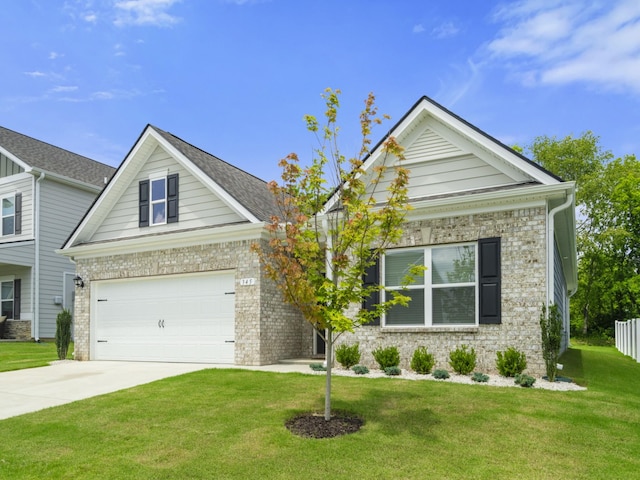 345 Winston Way, Gallatin, TN 37066 - view of front of home with concrete driveway, a front lawn, and brick siding