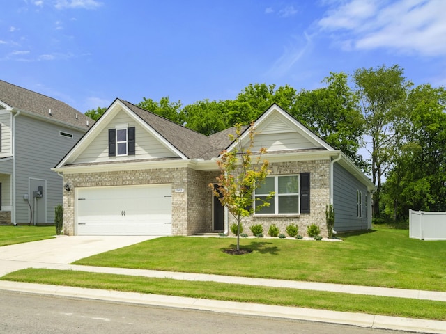 345 Winston Way, Gallatin, TN 37066 - view of front of home with driveway, a front lawn, a garage, and brick siding