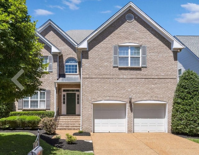 5521 Nevil Pt, Brentwood, TN 37027 - traditional-style home with a garage, concrete driveway, and brick siding