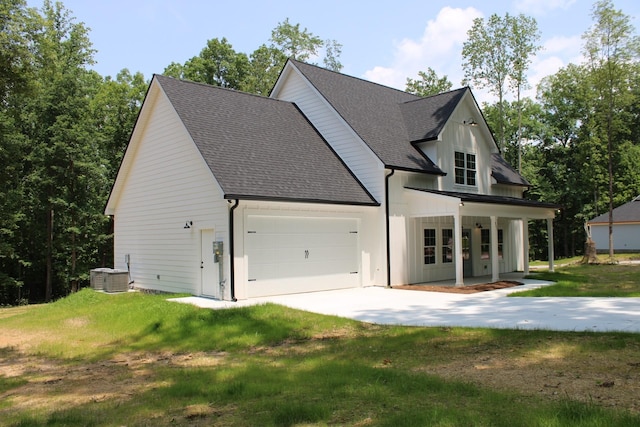 807 Hasty Ln, Estill Springs, TN 37330 - modern inspired farmhouse with roof with shingles, covered porch, a garage, a front lawn, and driveway