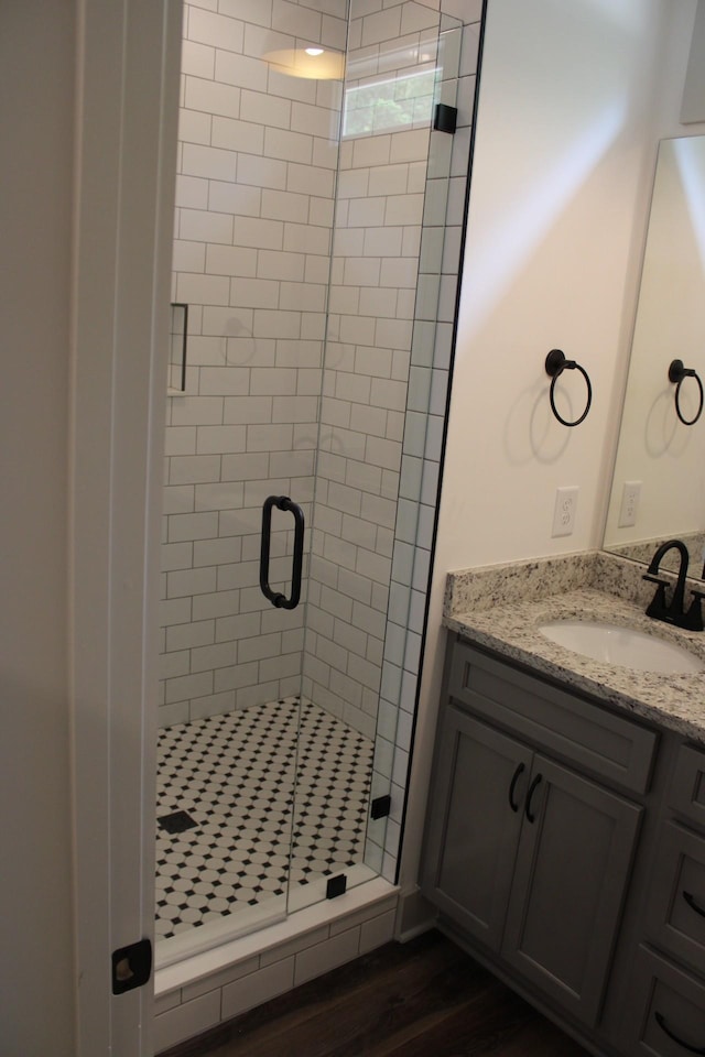 807 Hasty Ln, Estill Springs, TN 37330 - full bathroom featuring a shower stall, vanity, and wood finished floors