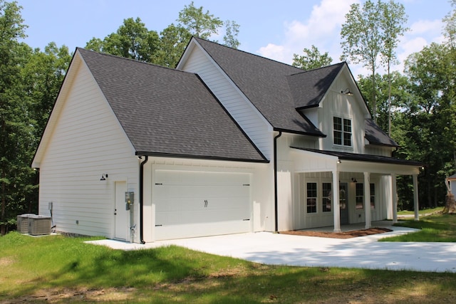 807 Hasty Ln, Estill Springs, TN 37330 - modern farmhouse featuring a shingled roof, driveway, covered porch, and a garage