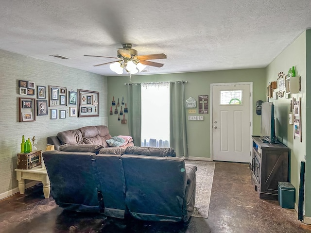 1097 Taylor Ln, Newbern, TN 38059 - living area featuring a ceiling fan, concrete floors, and a textured ceiling
