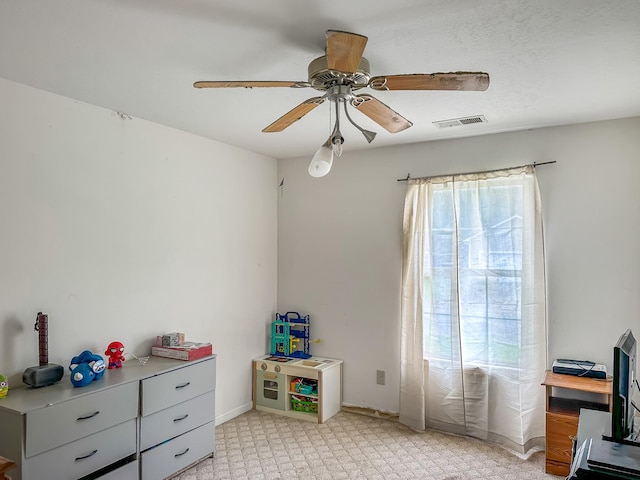 1097 Taylor Ln, Newbern, TN 38059 - recreation room with a ceiling fan and light colored carpet