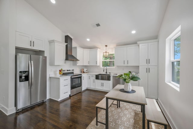 704 Pond Rd, Dickson, TN 37055 - kitchen featuring appliances with stainless steel finishes, wall chimney exhaust hood, dark wood-type flooring, white cabinets, and recessed lighting