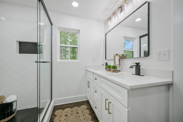 704 Pond Rd, Dickson, TN 37055 - bathroom featuring double vanity, tiled shower, wood finished floors, and recessed lighting