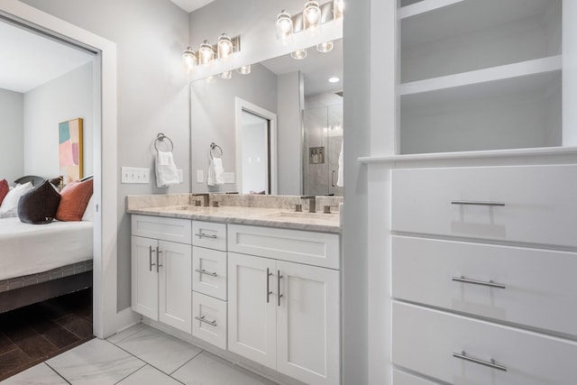 2410 Meharry Blvd Unit 3, Nashville, TN 37208 - ensuite bathroom with double vanity, a shower stall, and marble look tiles