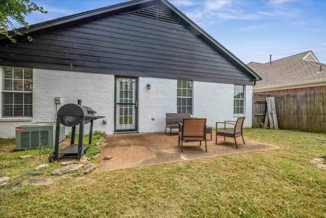 1117 Cross Wood Ln, Cordova, TN 38018 - rear view of house featuring a fenced backyard, brick siding, and a patio