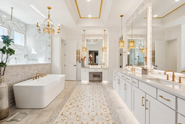 6004 Lookaway Cir, Franklin, TN 37067 - full bathroom featuring a freestanding tub, crown molding, double vanity, a chandelier, and a marble finish shower