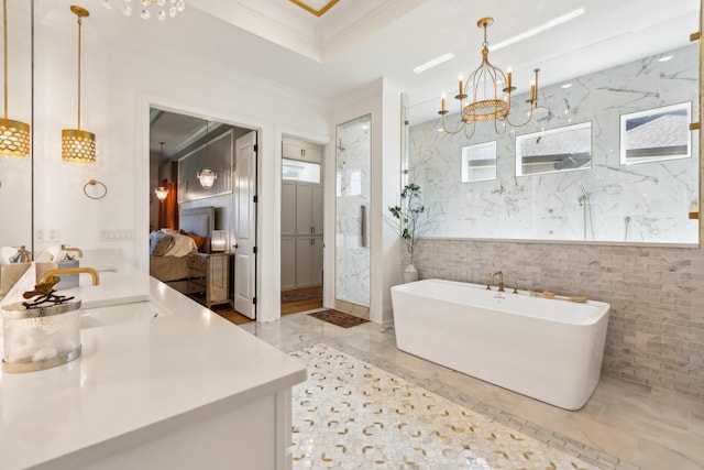 6004 Lookaway Cir, Franklin, TN 37067 - bathroom with double vanity, a soaking tub, a chandelier, ornamental molding, and a marble finish shower