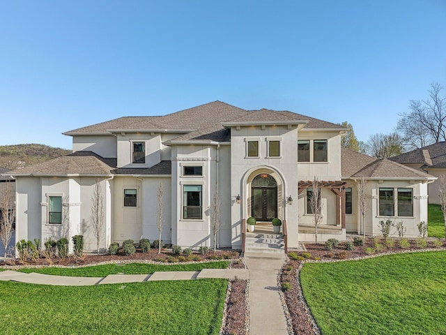 6004 Lookaway Cir, Franklin, TN 37067 - view of front of property with stucco siding, roof with shingles, and a front lawn