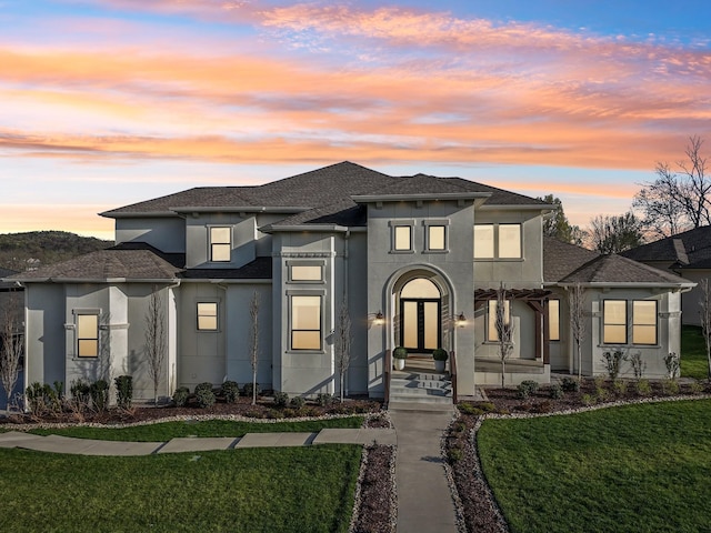 6004 Lookaway Cir, Franklin, TN 37067 - view of front facade featuring stucco siding, a front lawn, and a shingled roof