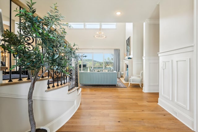 6004 Lookaway Cir, Franklin, TN 37067 - foyer entrance with a chandelier, a towering ceiling, light wood-type flooring, recessed lighting, and a decorative wall