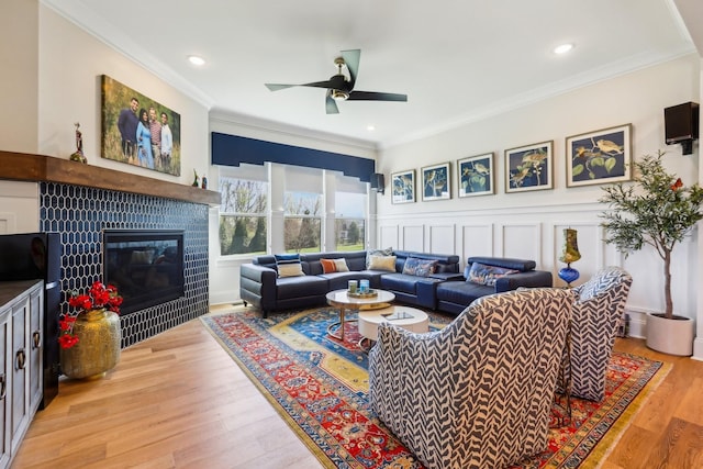 6004 Lookaway Cir, Franklin, TN 37067 - living area featuring crown molding, a ceiling fan, a fireplace, light wood-style flooring, and recessed lighting