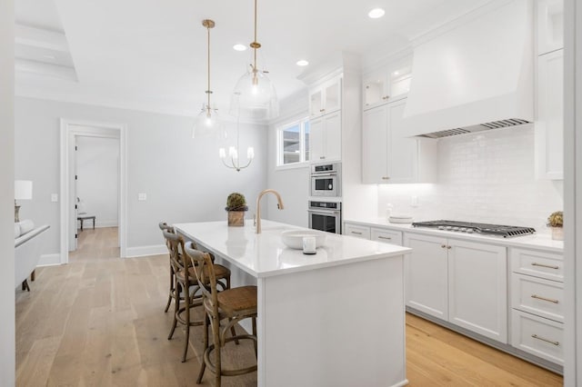 7018 Southvale Blvd, Franklin, TN 37064 - kitchen featuring custom range hood, appliances with stainless steel finishes, tasteful backsplash, recessed lighting, and white cabinetry