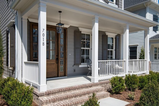 7018 Southvale Blvd, Franklin, TN 37064 - doorway to property with a porch and roof with shingles