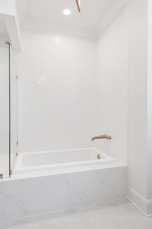 7018 Southvale Blvd, Franklin, TN 37064 - bathroom featuring a tub with marble appearance and recessed lighting