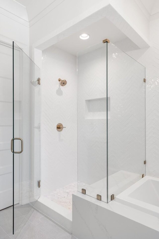 7018 Southvale Blvd, Franklin, TN 37064 - bathroom with a shower stall, tile patterned floors, and a bath