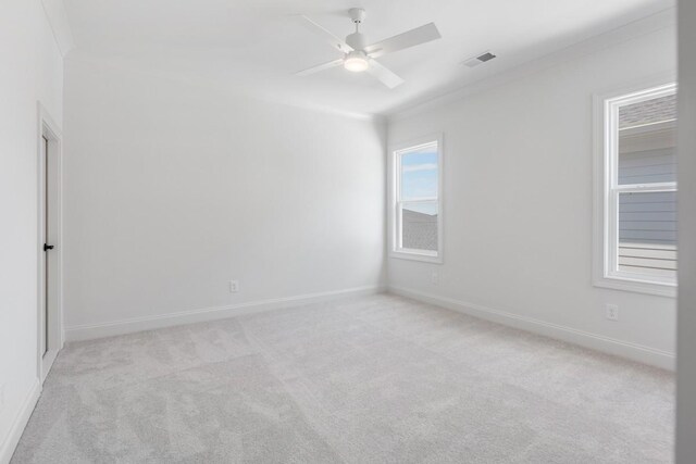 7018 Southvale Blvd, Franklin, TN 37064 - spare room with light colored carpet, ceiling fan, and ornamental molding