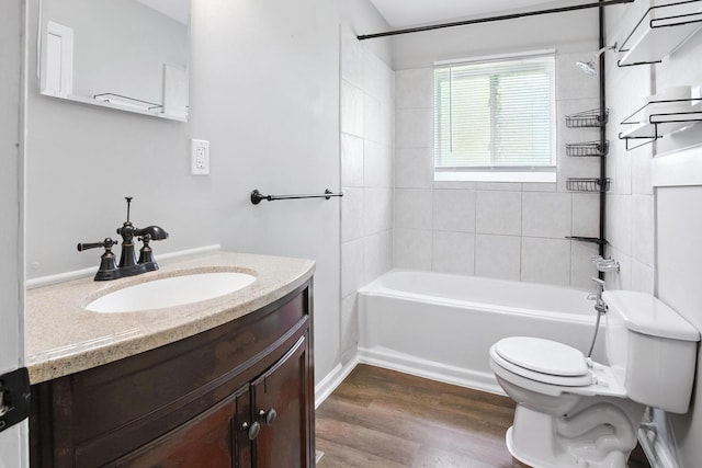 5011 Jarrett Rd, Chattanooga, TN 37416 - bathroom with vanity, shower / washtub combination, and wood finished floors