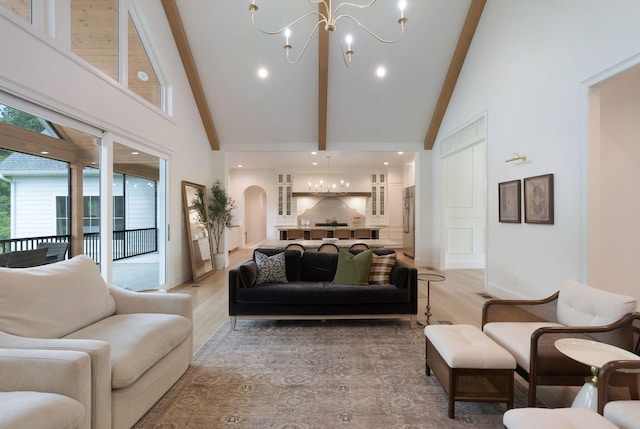 1744 Blackburn Ln, Spring Hill, TN 37174 - living area featuring a chandelier, high vaulted ceiling, beam ceiling, arched walkways, and light wood-style flooring
