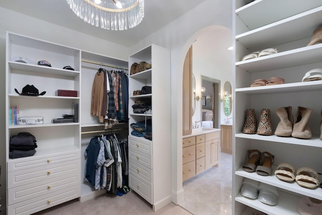 1744 Blackburn Ln, Spring Hill, TN 37174 - spacious closet with arched walkways, light carpet, and a chandelier