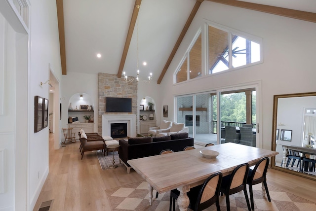1744 Blackburn Ln, Spring Hill, TN 37174 - dining space featuring a fireplace, high vaulted ceiling, beam ceiling, and light wood-style floors