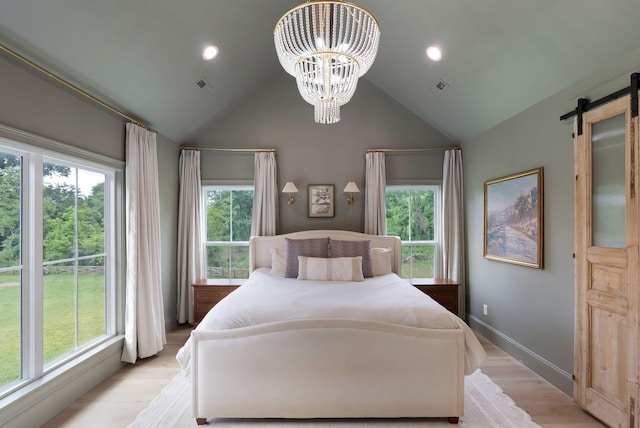 1744 Blackburn Ln, Spring Hill, TN 37174 - bedroom with a chandelier, a barn door, light wood-type flooring, high vaulted ceiling, and recessed lighting