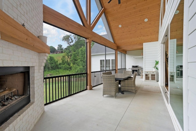 1744 Blackburn Ln, Spring Hill, TN 37174 - sunroom with an outdoor brick fireplace, plenty of natural light, outdoor dining space, and lofted ceiling