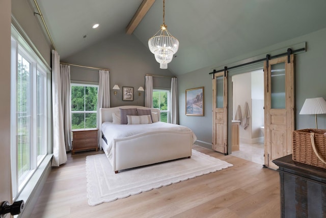 1744 Blackburn Ln, Spring Hill, TN 37174 - bedroom with a barn door, wood finished floors, a chandelier, and connected bathroom