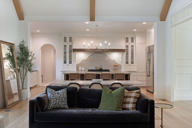 1744 Blackburn Ln, Spring Hill, TN 37174 - living room with beamed ceiling, arched walkways, a chandelier, recessed lighting, and light wood-style flooring