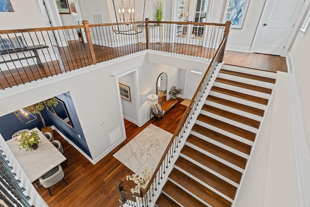 541 Lakeview Cir, Mount Juliet, TN 37122 - stairs featuring a chandelier, wood finished floors, and a towering ceiling