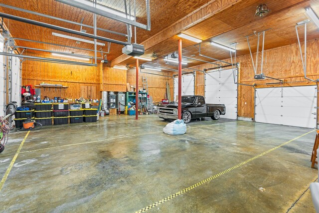 541 Lakeview Cir, Mount Juliet, TN 37122 - garage with a garage door opener and wooden walls