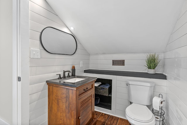 541 Lakeview Cir, Mount Juliet, TN 37122 - bathroom with lofted ceiling, vanity, wooden walls, and wood finished floors