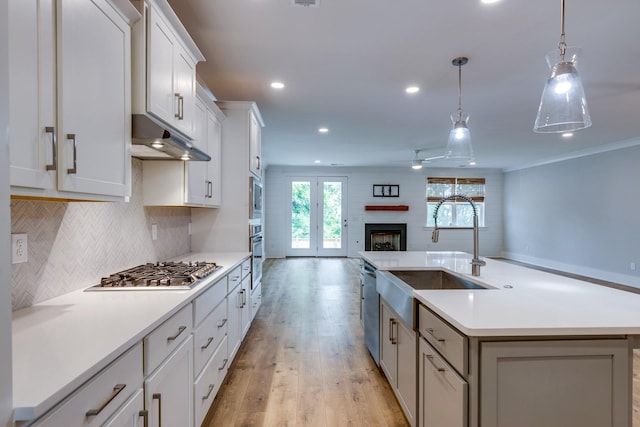 2110 Lequire Ln, Spring Hill, TN 37174 - kitchen featuring appliances with stainless steel finishes, open floor plan, recessed lighting, backsplash, and light countertops