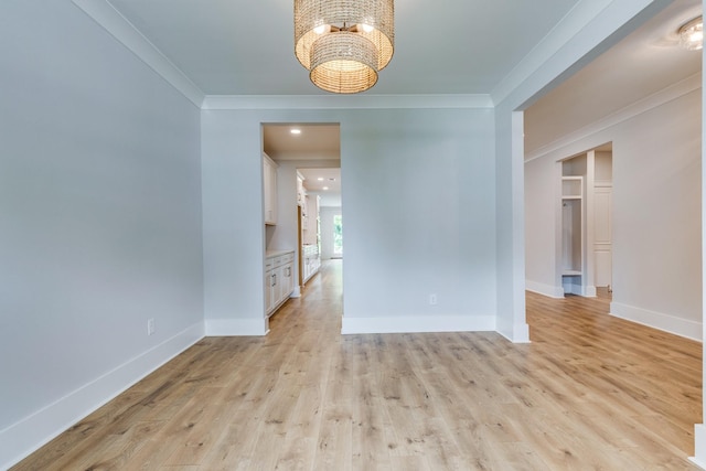 2110 Lequire Ln, Spring Hill, TN 37174 - spare room featuring ornamental molding, a chandelier, and light wood-style floors