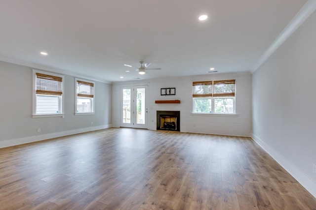 2110 Lequire Ln, Spring Hill, TN 37174 - unfurnished living room featuring a ceiling fan, healthy amount of natural light, wood finished floors, recessed lighting, and a fireplace