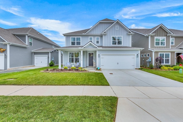 2110 Lequire Ln, Spring Hill, TN 37174 - craftsman-style home with board and batten siding, concrete driveway, a front yard, an attached garage, and covered porch